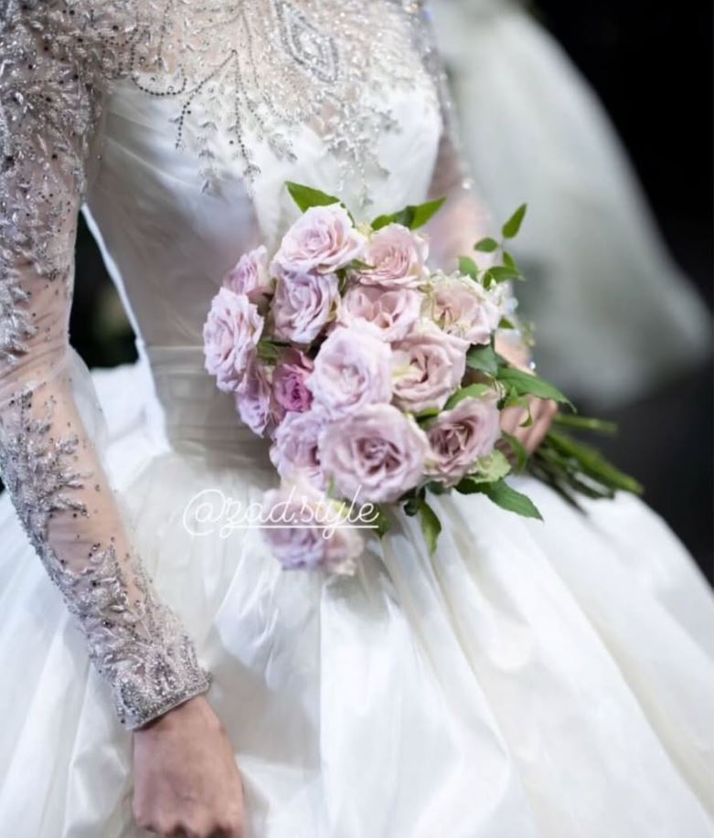 Bride holding lavender roses in an embellished gown, Zad Style