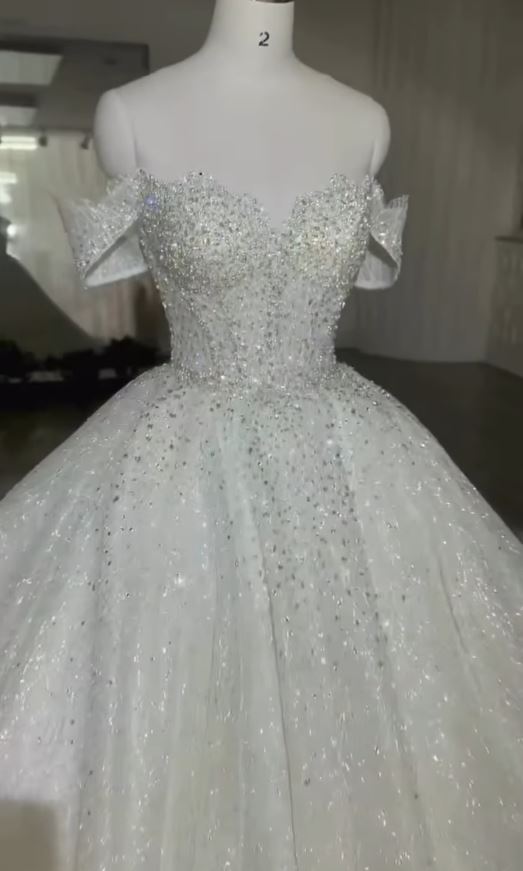 Off-shoulder crystal-embellished gown on mannequin, Zad Style